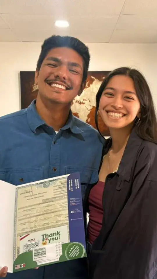 DNExpress client holding their Mexican and U.S. passports